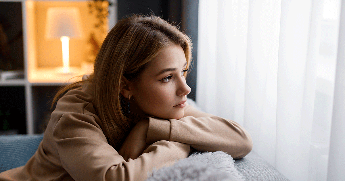 Mother sitting alone while worrying about her fussy baby
